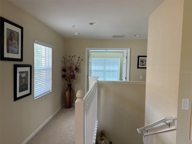 1288 Grady Ln, Davenport, FL 33896 - hall featuring an upstairs landing and carpet