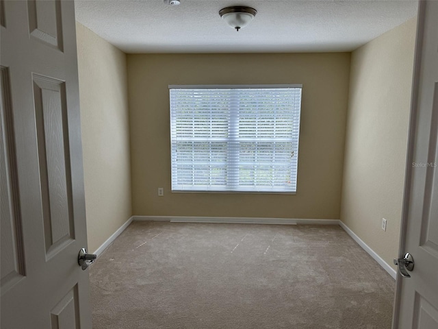 1288 Grady Ln, Davenport, FL 33896 - carpeted spare room featuring baseboards and a textured ceiling