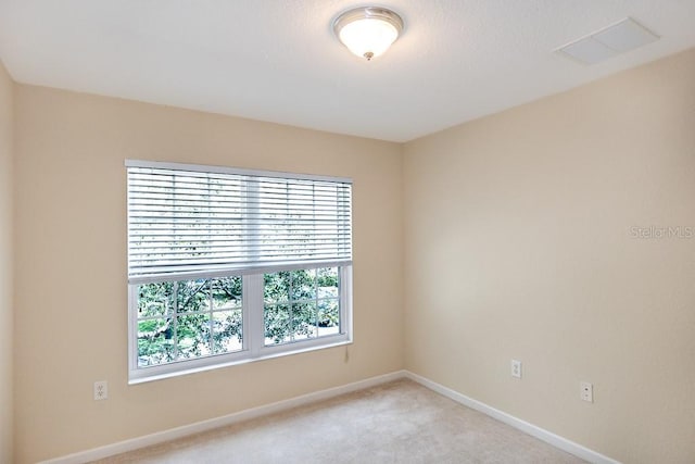 1288 Grady Ln, Davenport, FL 33896 - empty room featuring light carpet and baseboards