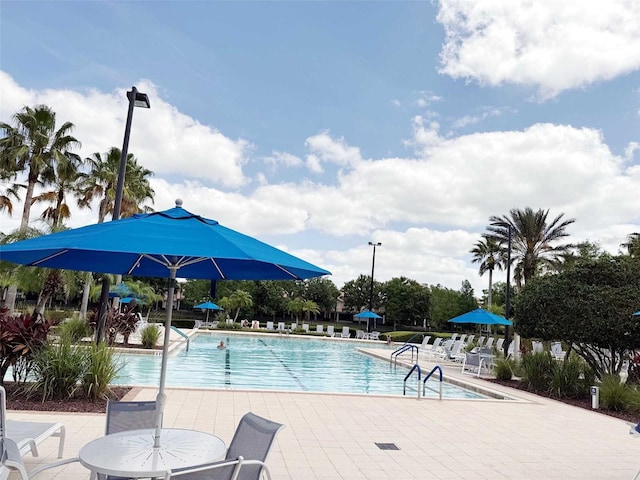 1288 Grady Ln, Davenport, FL 33896 - community pool featuring a patio