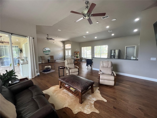 living room featuring a ceiling fan, visible vents, wood finished floors, baseboards, and recessed lighting