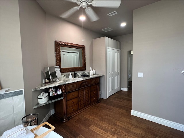 bathroom with a ceiling fan, visible vents, wood finished floors, and vanity