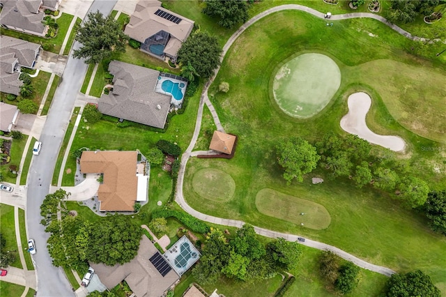 aerial view with a residential view and view of golf course