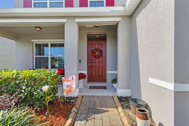 3441 Landing Vw, Tavares, FL 32778 - doorway to property with stucco siding and a porch