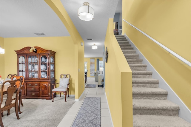 3441 Landing Vw, Tavares, FL 32778 - stairs featuring tile patterned flooring
