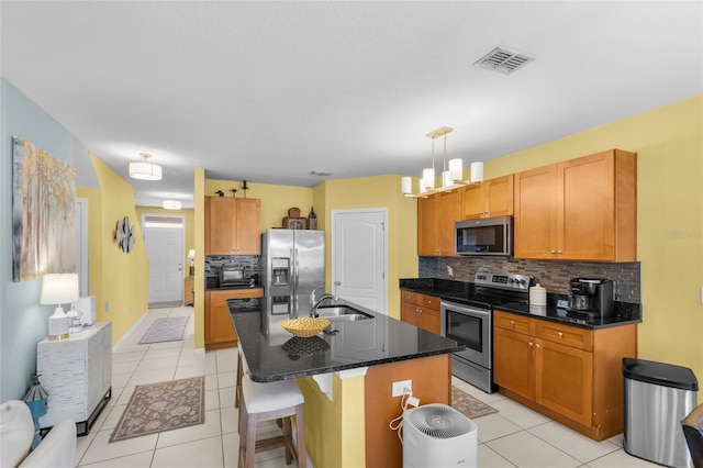 3441 Landing Vw, Tavares, FL 32778 - kitchen featuring appliances with stainless steel finishes, a sink, backsplash, and light tile patterned floors