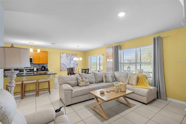 3441 Landing Vw, Tavares, FL 32778 - living area featuring baseboards, a chandelier, light tile patterned floors, and recessed lighting