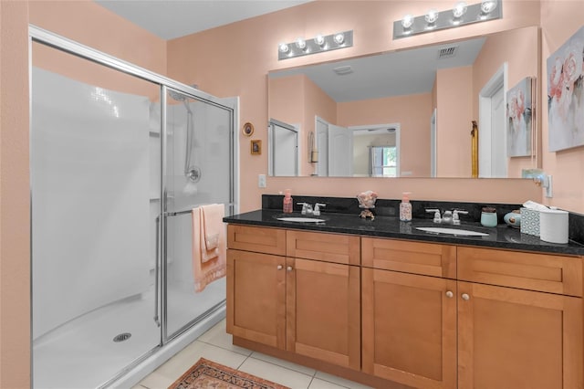 3441 Landing Vw, Tavares, FL 32778 - bathroom with a stall shower, double vanity, and tile patterned floors