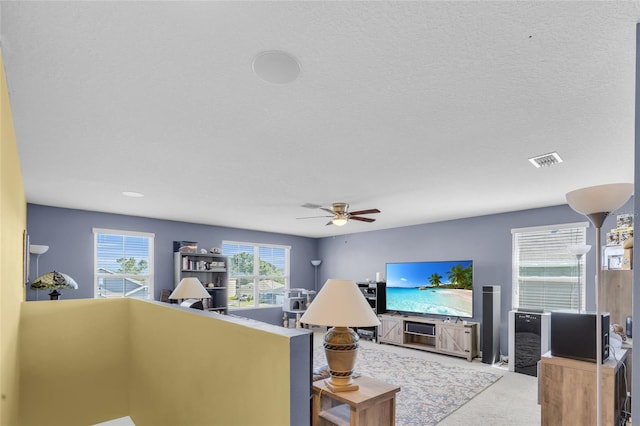 3441 Landing Vw, Tavares, FL 32778 - living area featuring carpet floors and ceiling fan
