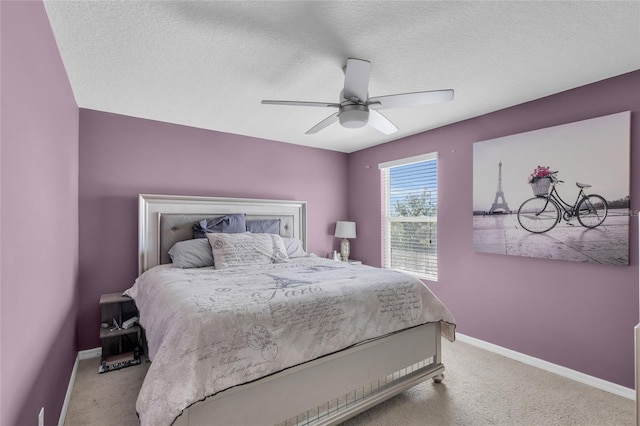 3441 Landing Vw, Tavares, FL 32778 - carpeted bedroom with baseboards, a ceiling fan, and a textured ceiling