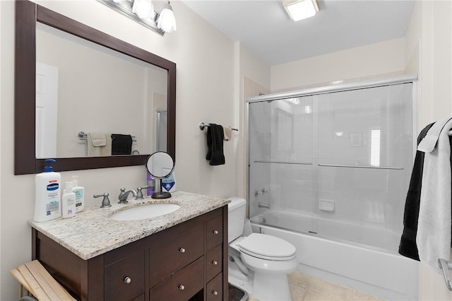 full bath featuring tile patterned floors, toilet, enclosed tub / shower combo, and vanity