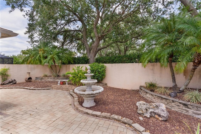 view of yard featuring a patio area and a fenced backyard