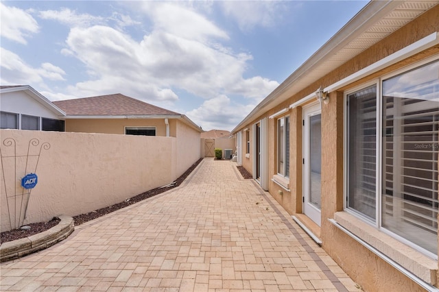 view of patio / terrace featuring fence
