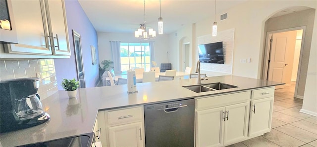 817 Ocean Course Ave Unit 502, Davenport, FL 33896 - kitchen with stainless steel dishwasher, a sink, light tile patterned floors, a chandelier, and pendant lighting