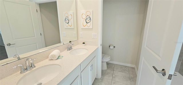 817 Ocean Course Ave Unit 502, Davenport, FL 33896 - bathroom with toilet, tile patterned floors, double vanity, and baseboards