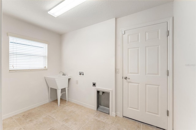 9181 SE 166th Sprung Ln, The Villages, FL 32162 - laundry area featuring laundry area, hookup for an electric dryer, light tile patterned floors, baseboards, and hookup for a washing machine