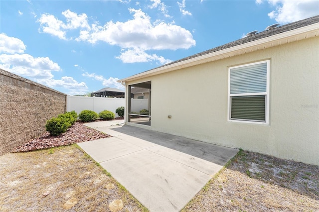 9181 SE 166th Sprung Ln, The Villages, FL 32162 - exterior space featuring a patio area, stucco siding, and a fenced backyard
