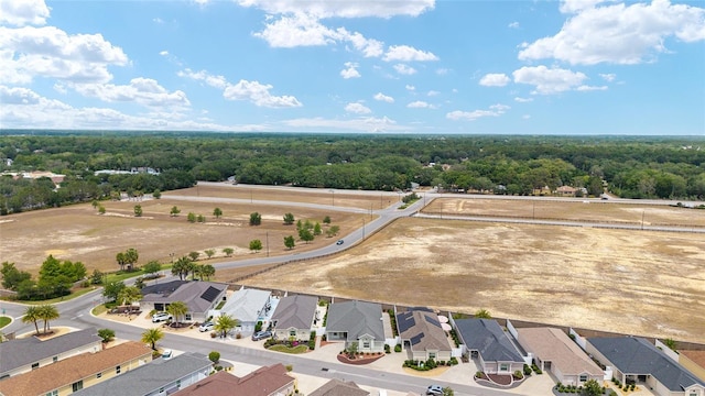 9181 SE 166th Sprung Ln, The Villages, FL 32162 - birds eye view of property with a residential view and a view of trees