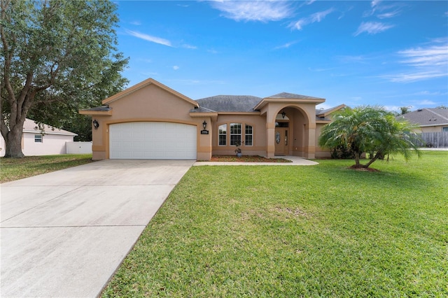 13336 Biscayne Dr, Grand Island, FL 32735 - mediterranean / spanish house with stucco siding, a garage, and concrete driveway