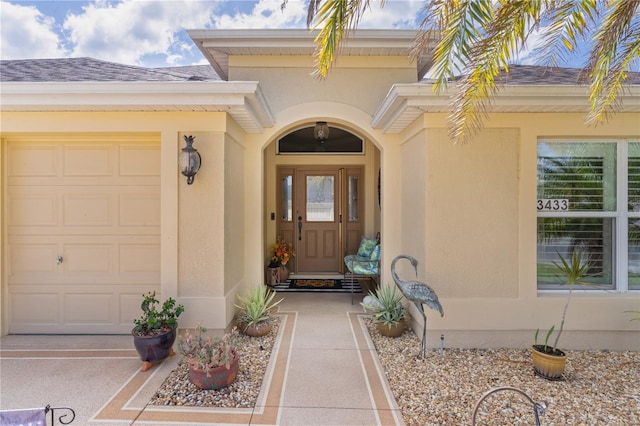 3433 Nestlebranch Ave, The Villages, FL 32163 - doorway to property with roof with shingles and stucco siding