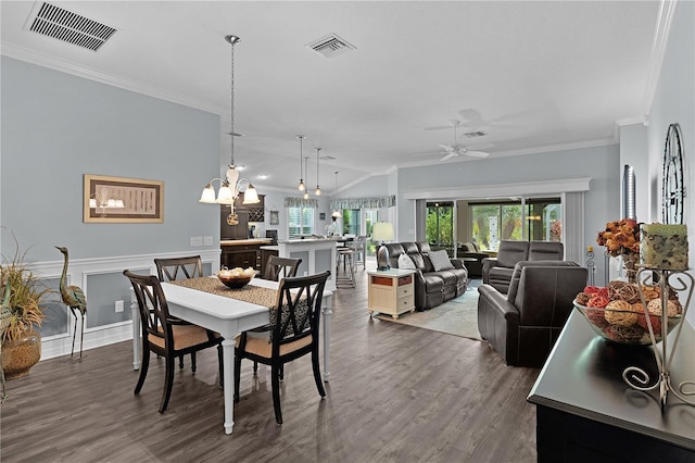 3433 Nestlebranch Ave, The Villages, FL 32163 - dining area featuring crown molding, visible vents, wood finished floors, and ceiling fan with notable chandelier