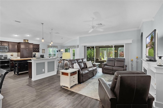 3433 Nestlebranch Ave, The Villages, FL 32163 - living area featuring crown molding, ceiling fan, wood finished floors, and visible vents