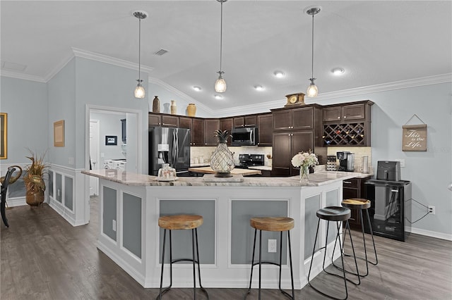 3433 Nestlebranch Ave, The Villages, FL 32163 - kitchen featuring backsplash, stainless steel appliances, visible vents, and dark brown cabinets