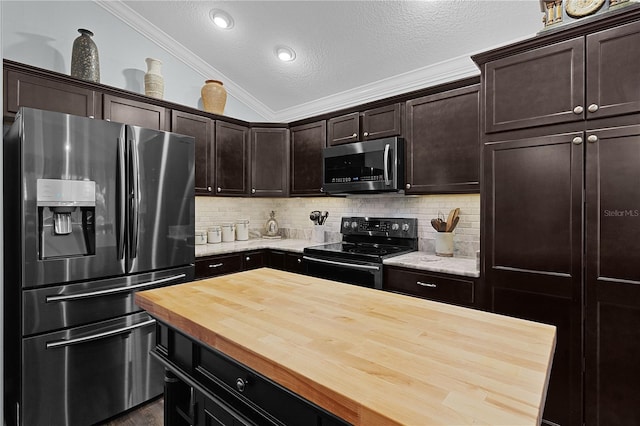 3433 Nestlebranch Ave, The Villages, FL 32163 - kitchen with decorative backsplash, dark brown cabinets, wood counters, ornamental molding, and stainless steel appliances