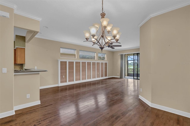 8167 Bridgeport Bay Cir, Mount Dora, FL 32757 - unfurnished dining area with a chandelier, baseboards, dark wood-style floors, and ornamental molding