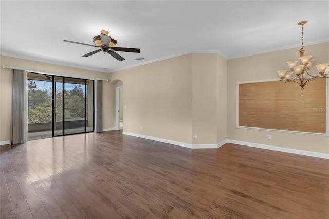 8167 Bridgeport Bay Cir, Mount Dora, FL 32757 - spare room featuring arched walkways, dark wood finished floors, ceiling fan, a chandelier, and ornamental molding