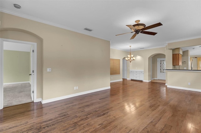 8167 Bridgeport Bay Cir, Mount Dora, FL 32757 - unfurnished living room featuring arched walkways, a chandelier, a ceiling fan, ornamental molding, and hardwood / wood-style flooring