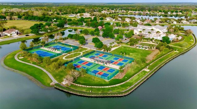8167 Bridgeport Bay Cir, Mount Dora, FL 32757 - aerial view of residential area featuring a nearby body of water and a tree filled landscape