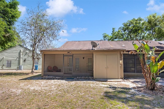 rear view of house with a sunroom