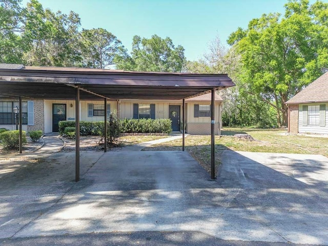 view of parking / parking lot featuring a carport