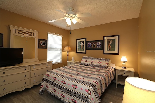 1482 Azteca Loop, The Villages, FL 32162 - bedroom featuring a ceiling fan, a textured ceiling, and wood finished floors