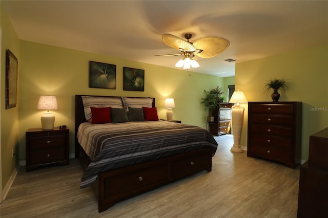 1482 Azteca Loop, The Villages, FL 32162 - bedroom with baseboards, a ceiling fan, visible vents, and wood finished floors