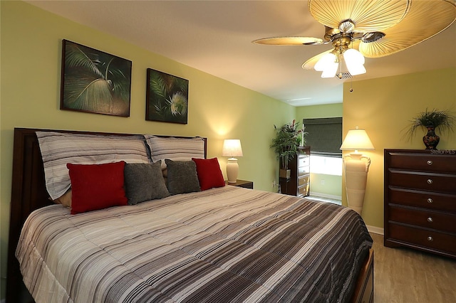 1482 Azteca Loop, The Villages, FL 32162 - bedroom featuring ceiling fan, baseboards, and wood finished floors
