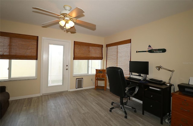 1482 Azteca Loop, The Villages, FL 32162 - office space featuring baseboards, a ceiling fan, and wood finished floors