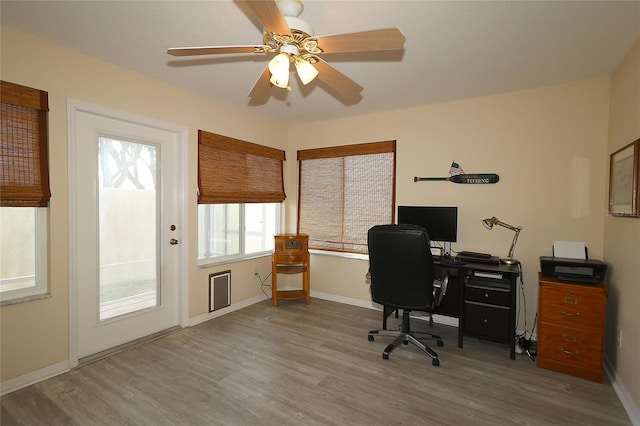 1482 Azteca Loop, The Villages, FL 32162 - home office featuring baseboards, ceiling fan, and wood finished floors