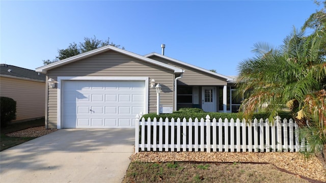 1070 Pinewood Pl, The Villages, FL 32162 - ranch-style home featuring concrete driveway, fence, and an attached garage