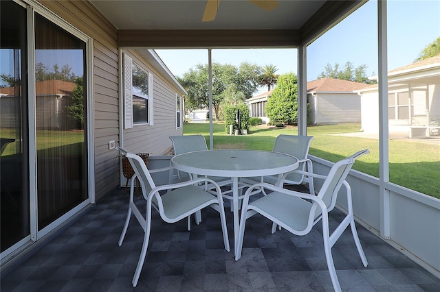 1070 Pinewood Pl, The Villages, FL 32162 - sunroom with a ceiling fan and outdoor dining area