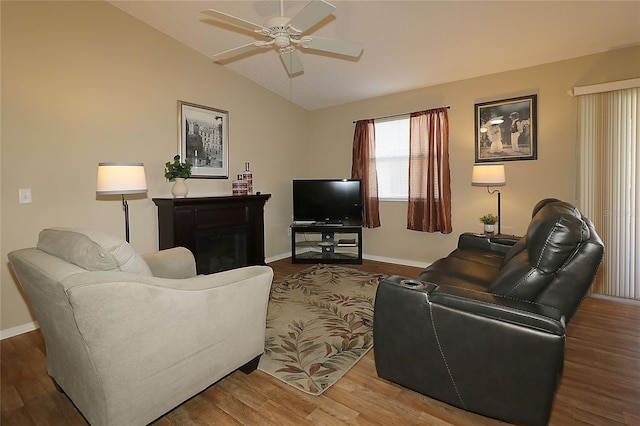 1070 Pinewood Pl, The Villages, FL 32162 - living area with lofted ceiling, ceiling fan, wood finished floors, and baseboards