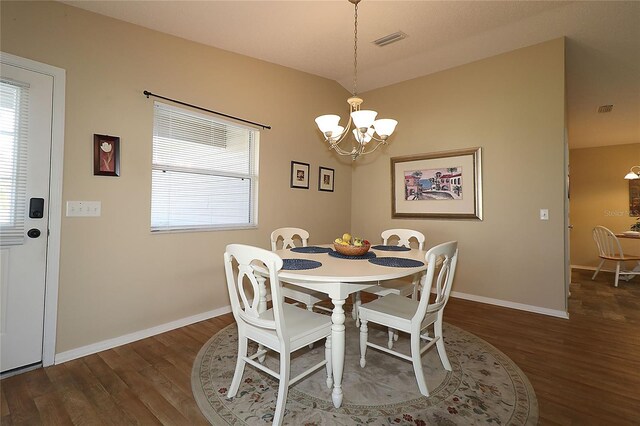 1070 Pinewood Pl, The Villages, FL 32162 - dining room with wood finished floors, a chandelier, and baseboards
