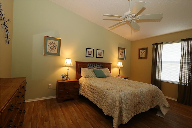 1070 Pinewood Pl, The Villages, FL 32162 - bedroom featuring dark wood-style flooring, baseboards, lofted ceiling, and ceiling fan