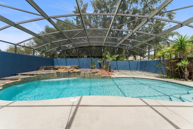 view of swimming pool with a fenced in pool, a jacuzzi, and a patio