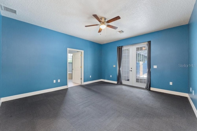 spare room featuring visible vents, baseboards, ceiling fan, and french doors