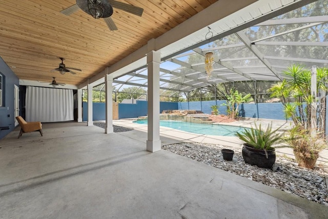 view of pool featuring a ceiling fan, a lanai, a hot tub, a fenced in pool, and a patio
