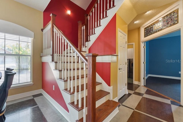 stairs with a healthy amount of sunlight and baseboards