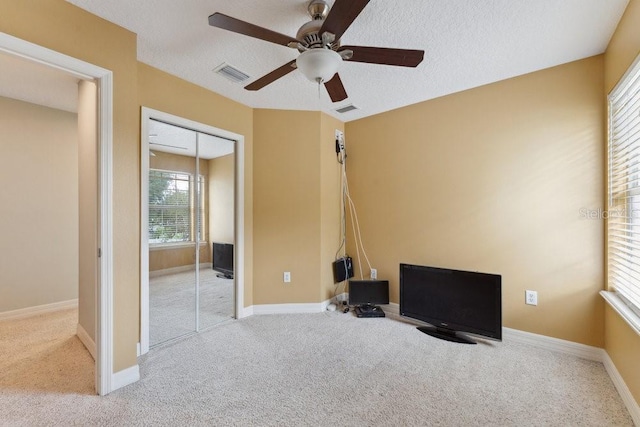 unfurnished bedroom featuring visible vents, carpet, and a closet
