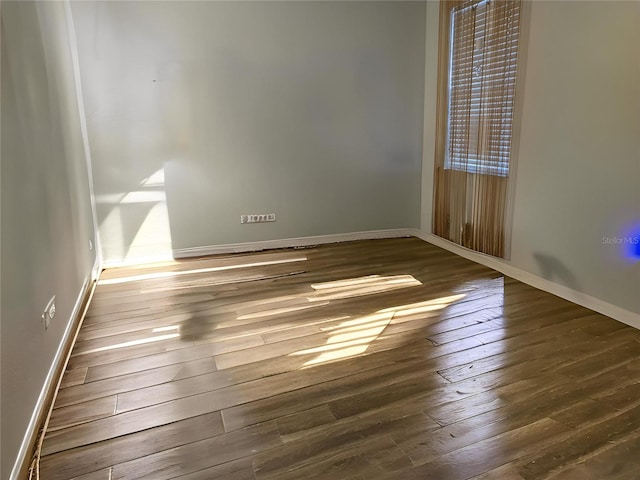 1231 Merion Dr, Mount Dora, FL 32757 - spare room with hardwood / wood-style floors and baseboards